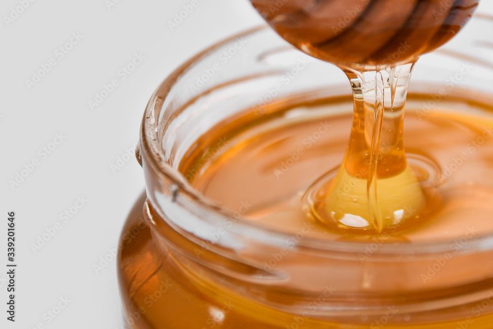 golden yellow transparent fresh honey in bottle golden yellow transparent fresh honey in bottle