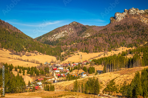 Landscape with mountains springtime. The Stefanova Village under The Great Rozsutec hill in The Mala Fatra National Park in Slovakia, Europe. photo