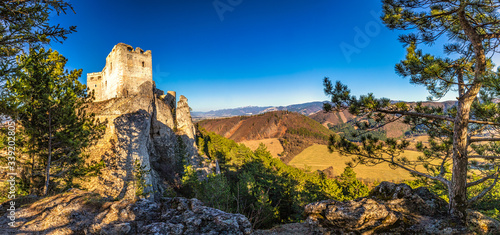 The medieval castle Lietava on a rocky reef with panoramic view of the surrounding landscape, nearby Zilina town, Slovakia, Europe.