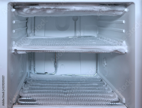 a very icy open freezer photo