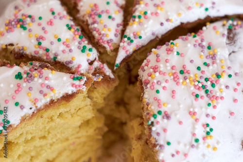 Sweet Easter cake cut with a knife into pieces. Close-up