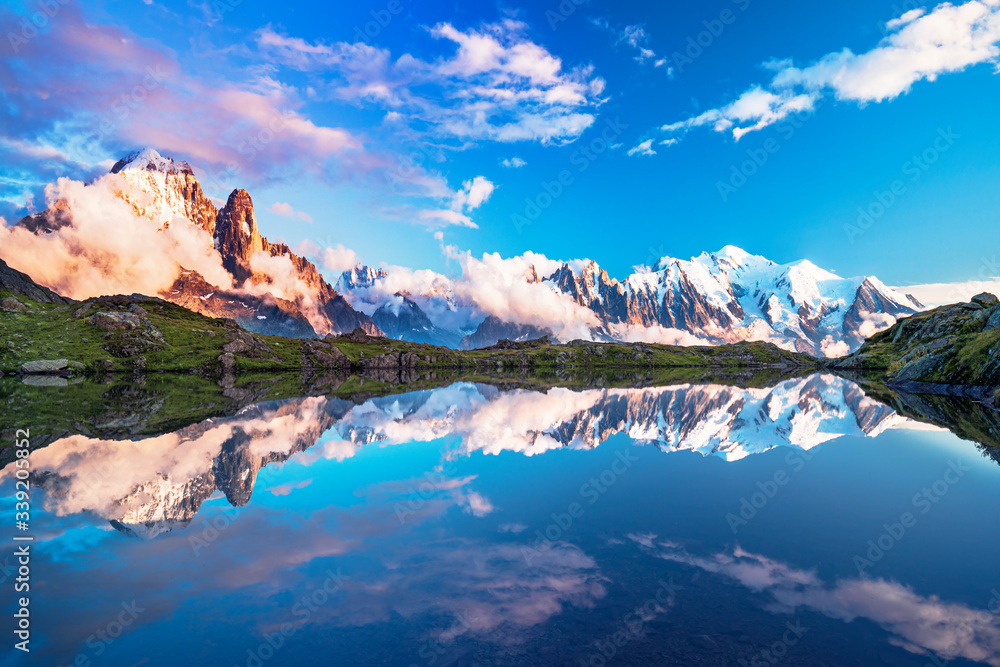 Magical sunset panorama of the Lac Blanc lake and Mont Blanc (Monte Bianco) on background, Chamonix location. Beautiful outdoor scene in Vallon de Berard Nature Reserve, France
