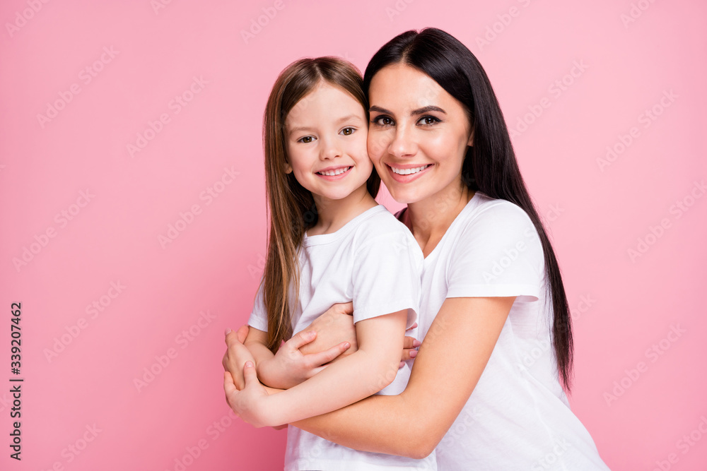 Close-up portrait of two nice attractive lovely adorable perfect ideal sweet cute careful cheerful adopted foster long-haired sister cuddling embracing upbringing isolated pink pastel color background Close-up portrait of two nice attractive lovely adorable perfect ideal sweet cute careful cheerful adopted foster long-haired sister cuddling embracing upbringing isolated pink pastel color background