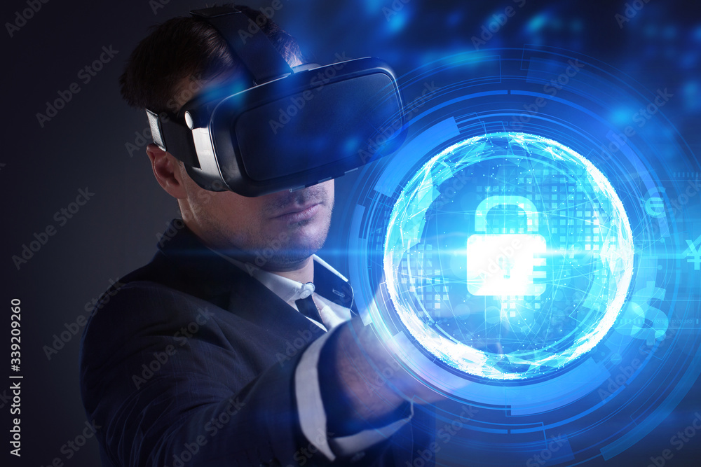 Business, Technology, Internet and network concept. Young businessman working on a virtual screen of the future and sees the inscription: Business, Technology, Internet and network concept. Young businessman working on a virtual screen of the future and sees the inscription: