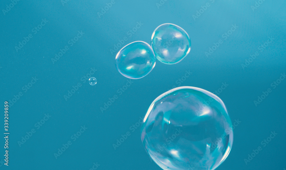 Shampoo bubbles floating like flying in the air by wind blow which represent refreshing playful or joyful moments and gentle soft comfortable and look wet and soapy for hygiene detergent product indus