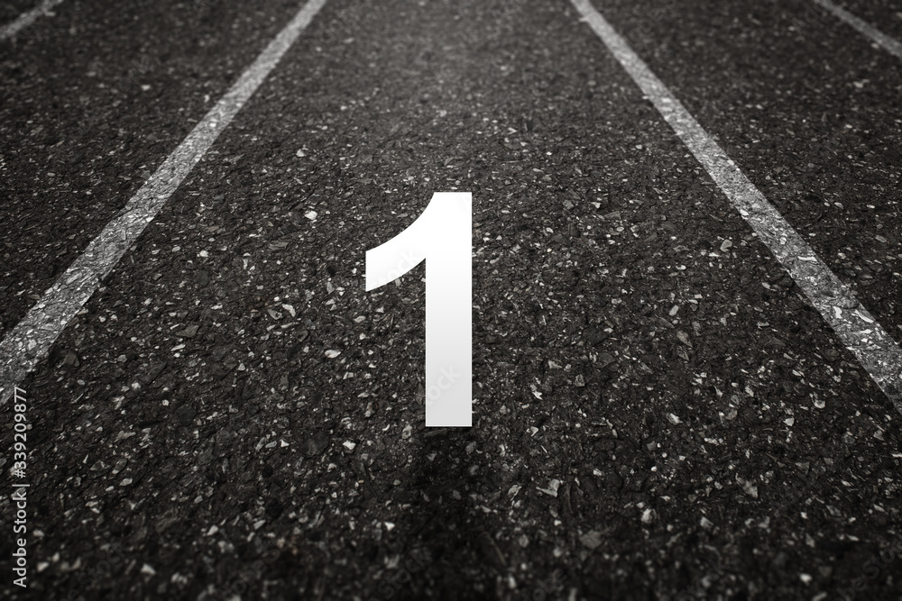 Asphalt road with Number one on the surface. An image of a milestone roadmap is a representation of success in the future goal
