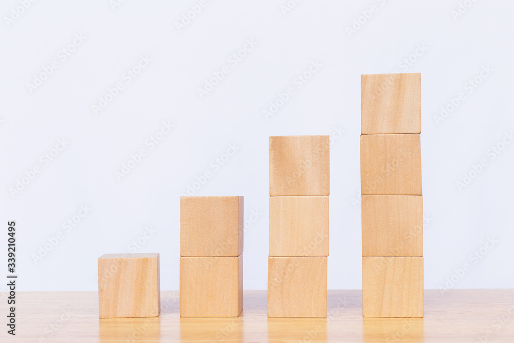 Wooden cube stack a staircase on white background. Concept of success, winner, victory or top ranking Wooden cube stack a staircase on white background. Concept of success, winner, victory or top ranking