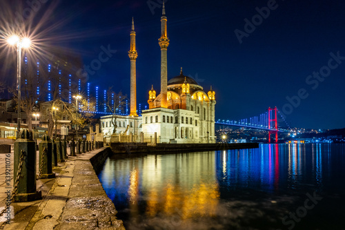 Istanbul landscape at night. Ortakoy Mosque and bosphorus bridge