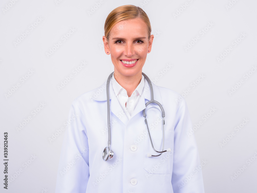 Portrait of happy blonde woman doctor smiling