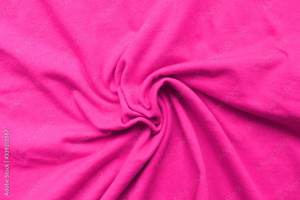 Obraz premium Creased violet cloth texture background. Blank wrinkle textile material, colorful creased purple sheet, close up top view of crumpled cloth. Uneven surface with spiral wrinkles pattern