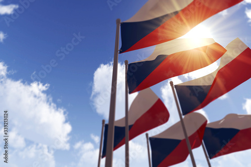 Czech Republic flags waving in the wind against a blue sky. 3D Rendering