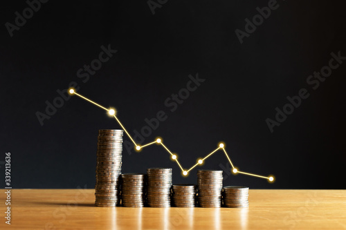 Growing stack of coins with a graph of profit. Concept for property, ladder ,real estate investment and saving