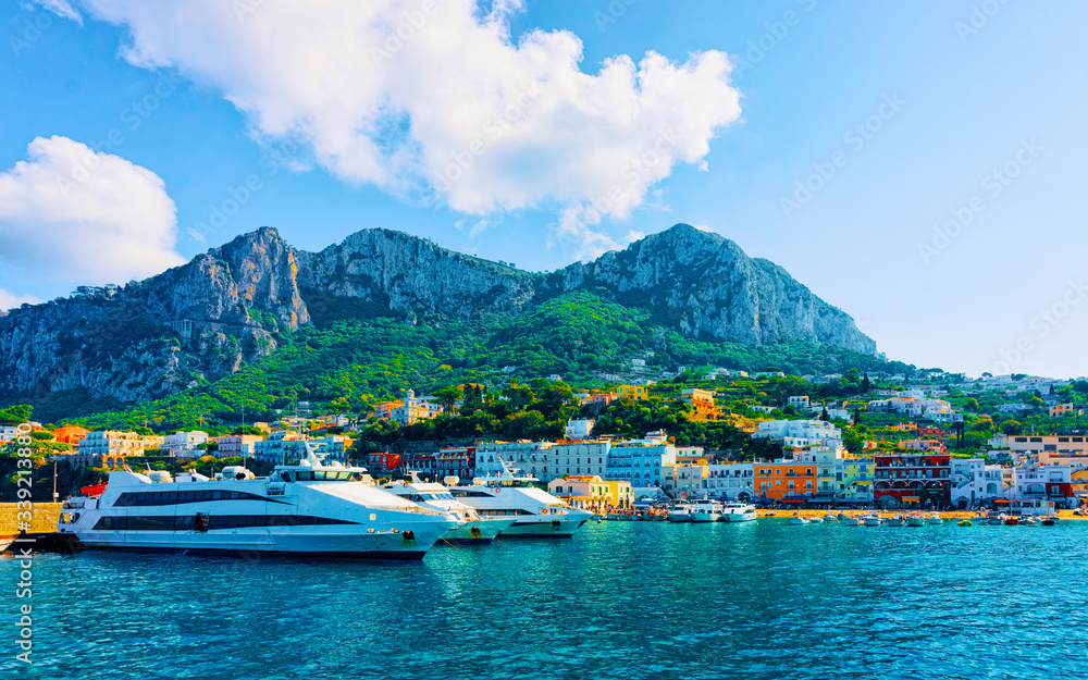 Marina with yachts in Capri Island town at Naples Italy reflex