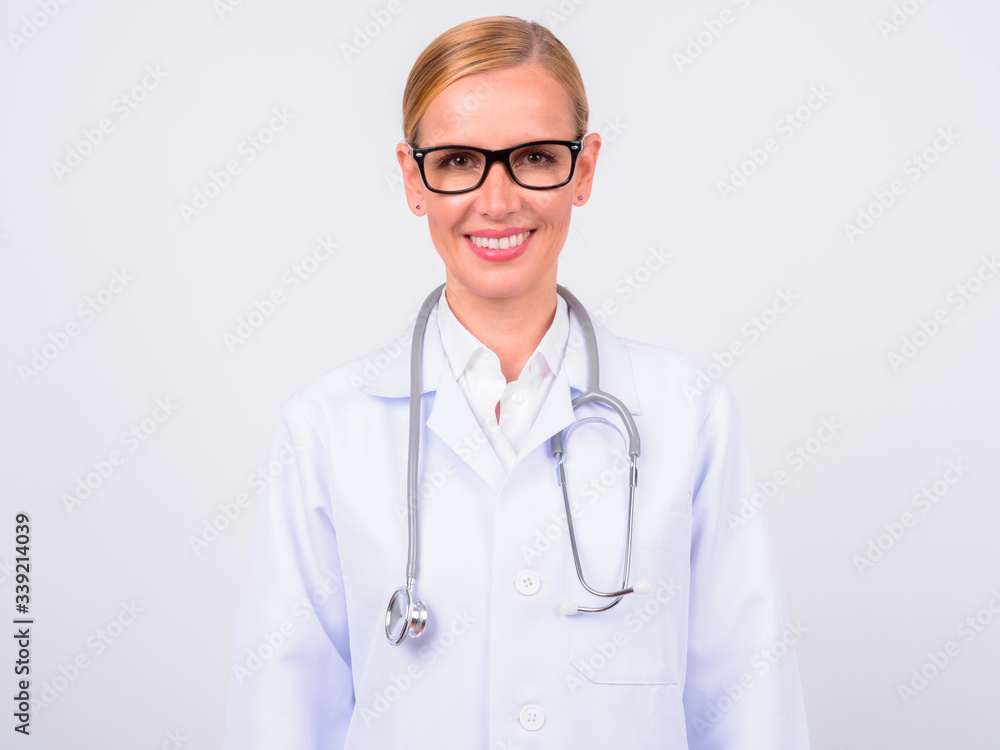 Portrait of happy blonde woman doctor with eyeglasses smiling Portrait of happy blonde woman doctor with eyeglasses smiling