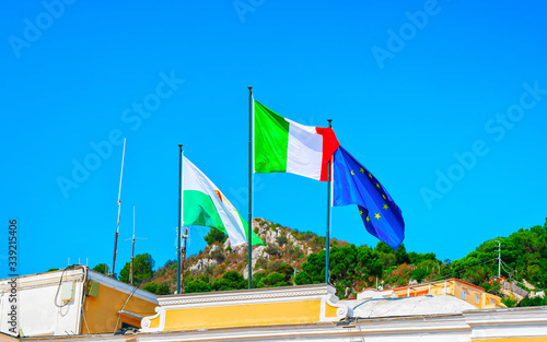 Flags on building on Capri Island reflex photo