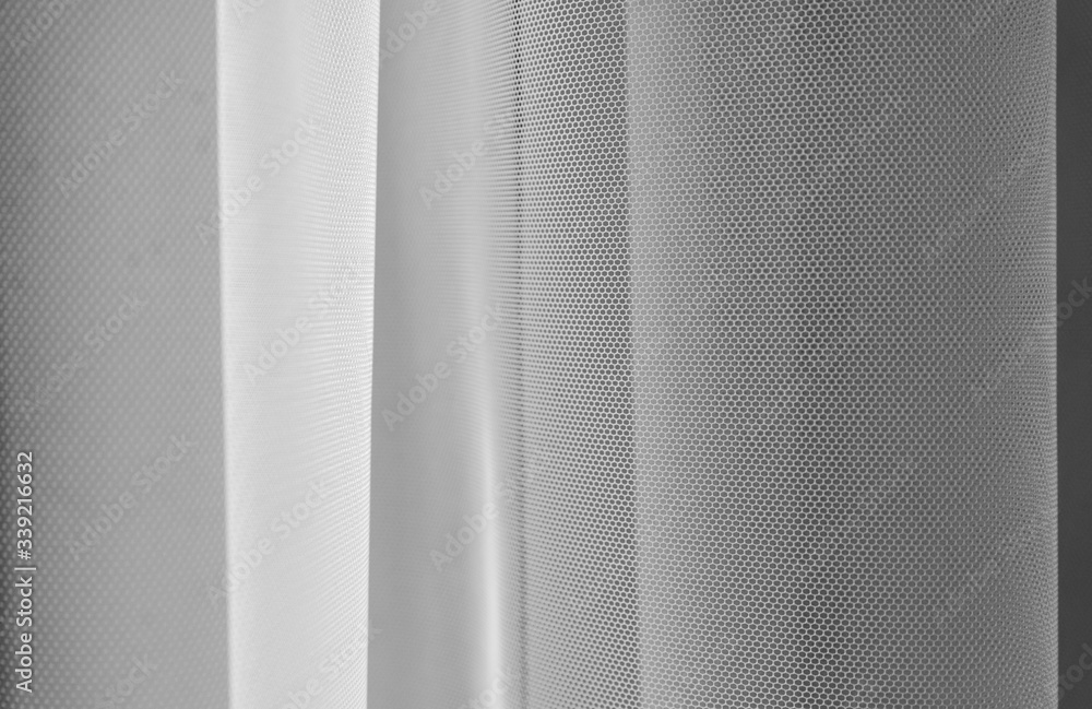 Fototapeta premium White tulle fabric abstract background,white tulle background,selective focus