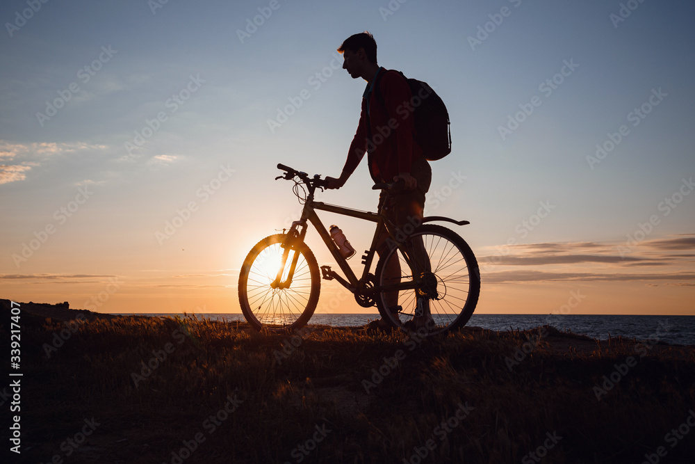 Silhouette of cyclist in motion at beautiful sunset. Silhouette of cyclist in motion at beautiful sunset.