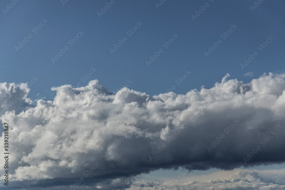 Obraz premium Beautiful fluffy clouds in the blue sky