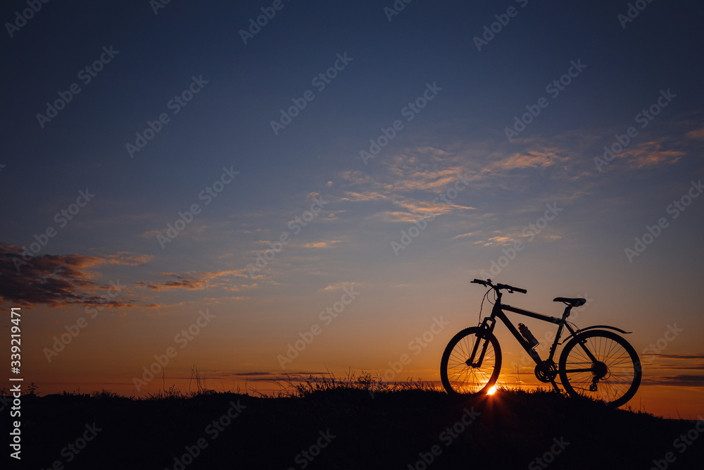 silhouette of a bicycle on the sunset sky silhouette of a bicycle on the sunset sky