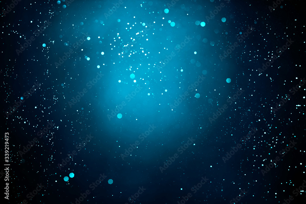 Obraz premium Abstract dark background with glowing turquoise particles.