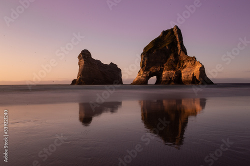 Elephant rock at Wharariki Beach, New Zealand. Sunset