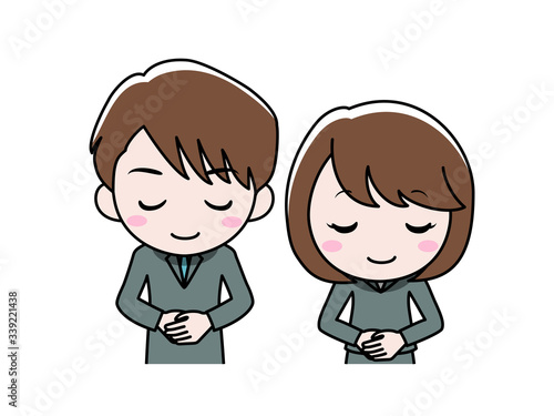 お辞儀をしているスーツ姿の男女