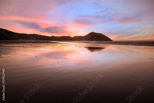 Elephant rock at Wharariki Beach, New Zealand. Sunset © liliportfolio