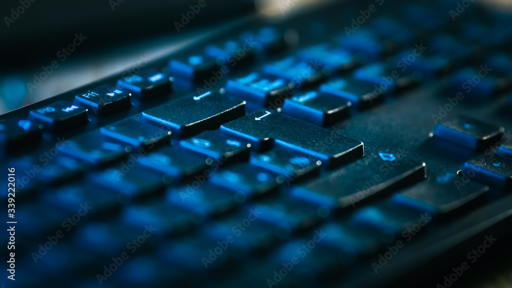 Close-up Macro Shot of  Black Computer Keyboard . Working, Writing Emails, Using Internet. Dark and Blue Colors