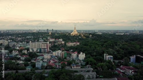 Yangon (Shwedagon pagoda) at sunset by drone in 4K. Over the city forward movement.