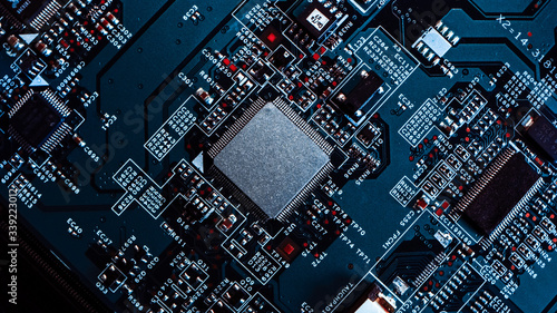 Macro Close-up Shot of Microchip, CPU Processor on Black Printed Circuit Board, Computer Motherboard with Components Inside of Electronic Device, Part of Supercomputer. photo