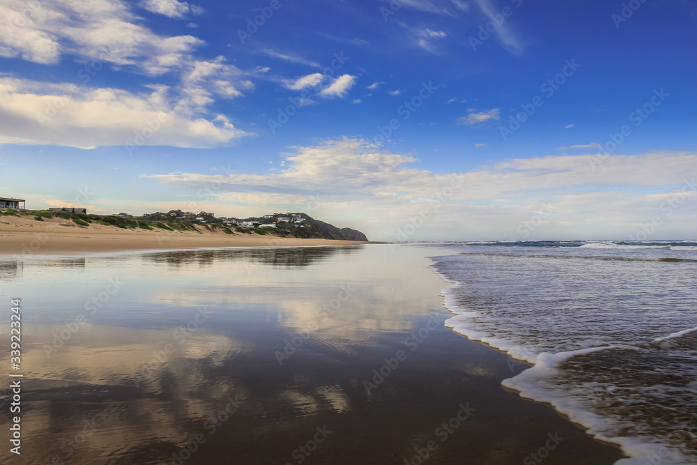 Reflective beach scene in Sedgefield, Kynsna, South Africa.