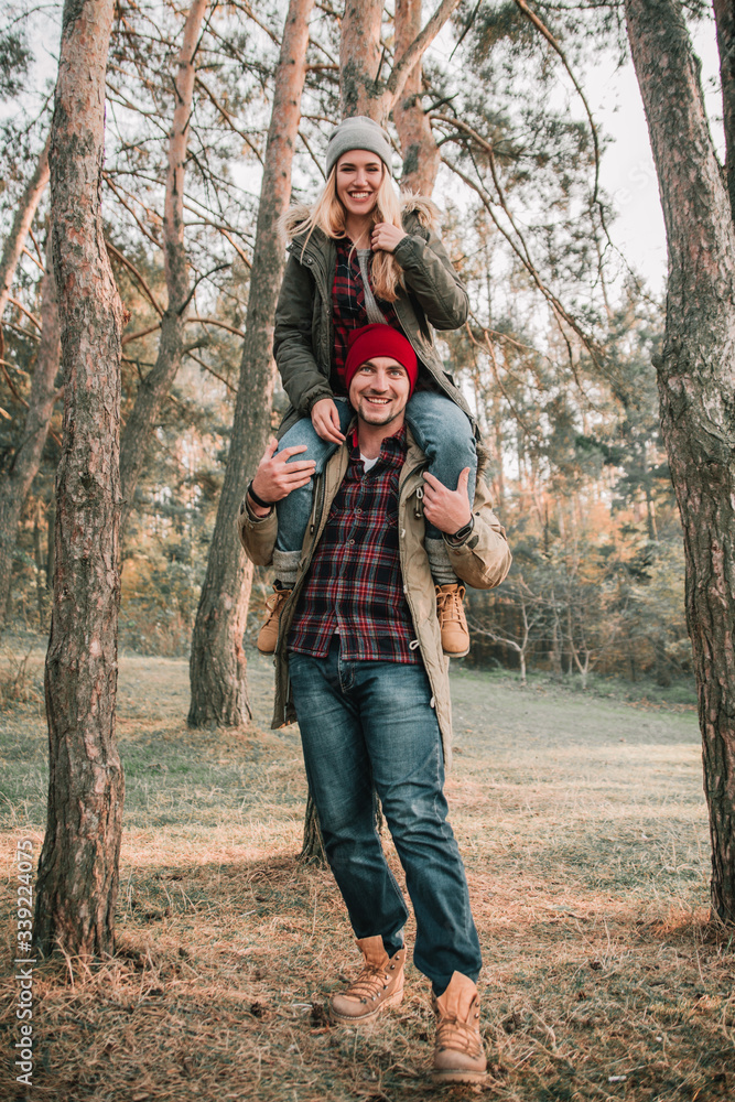 Couple travelers is so fun in the forest. Concept of trekking, adventure and seasonal vacation.