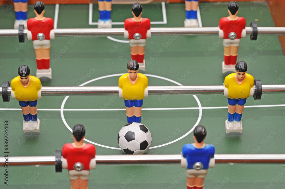 Fototapeta premium Table soccer football game - sports betting in the world of football - pleyers and euro mo