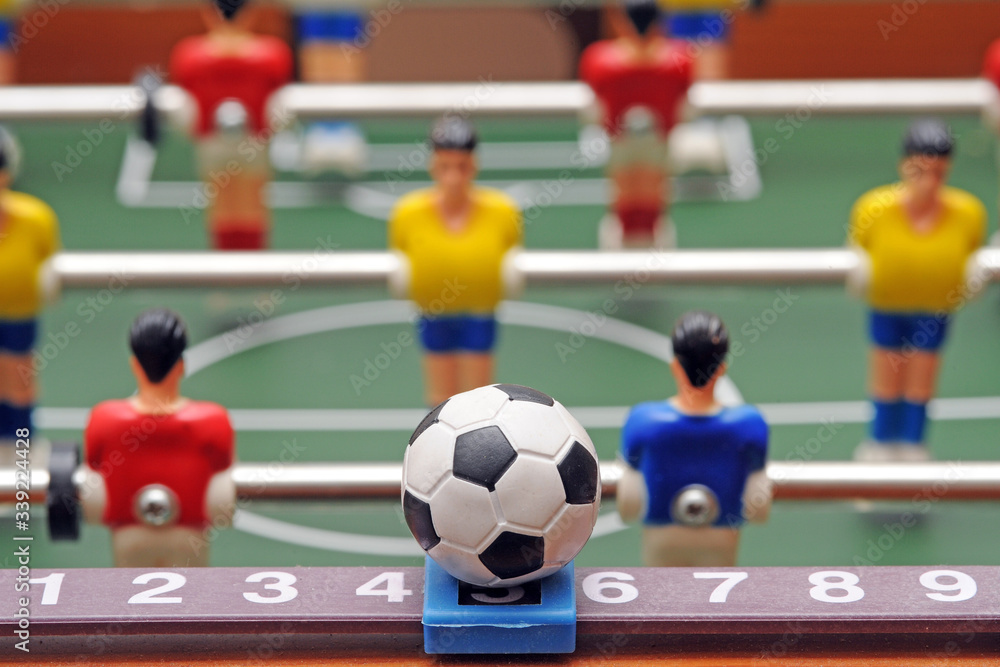 Fototapeta premium Table soccer football game - sports betting in the world of football - pleyers and euro mo