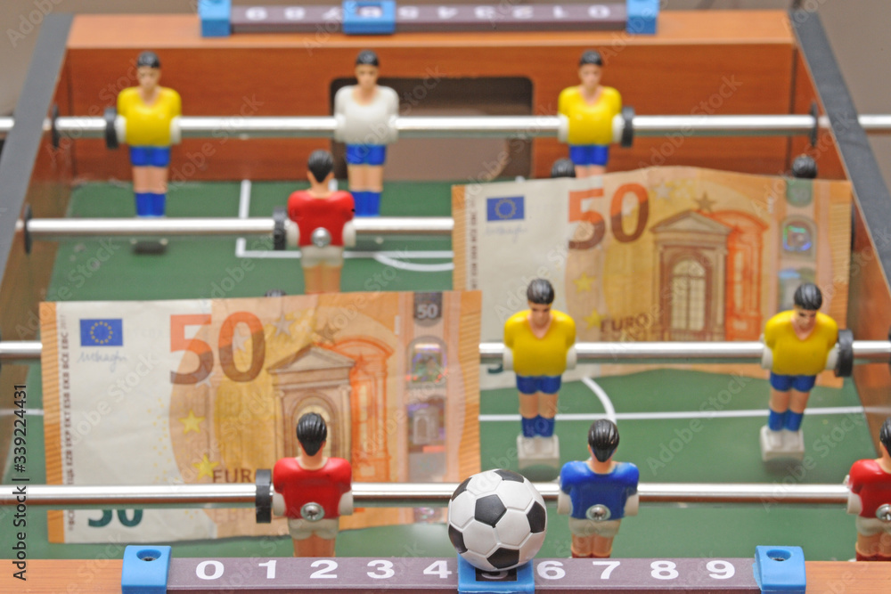 Fototapeta premium Table soccer football game - sports betting in the world of football - pleyers and euro mo