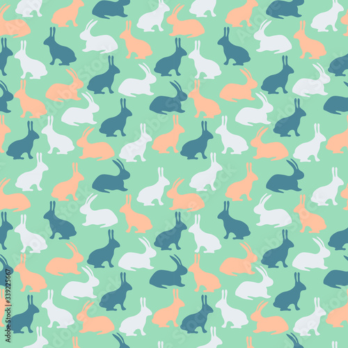 Seamless pattern with blue, orange and light gray rabbits on green background. Vector illustration for wallpaper, wrapping paper, textile, fabric and Easter design. 