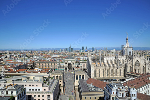 Italy - Milan march 19,2020 - Vittorio Emanuel Gallery, Duomo Cathedral and skyline with mountains - City life and downtown , aerial view 