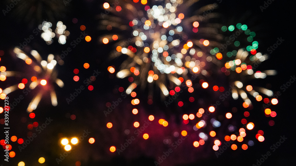 Festive colored fireworks on background a night sky