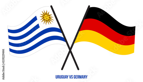 Uruguay and Germany Flags Crossed And Waving Flat Style. Official Proportion. Correct Colors