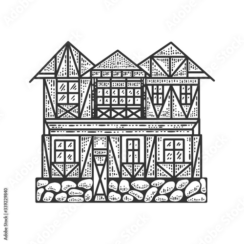 Timber framing fachwerk house sketch engraving vector illustration. T-shirt apparel print design. Scratch board imitation. Black and white hand drawn image.