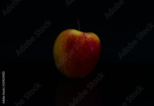 Apple in dark black background