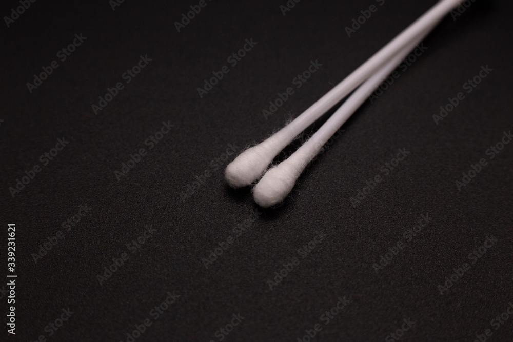 Ear sticks on a black background Ear sticks on a black background