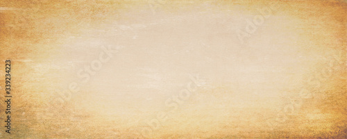Valokuva Abstract brown background with bright center spotlight and dark vignette border