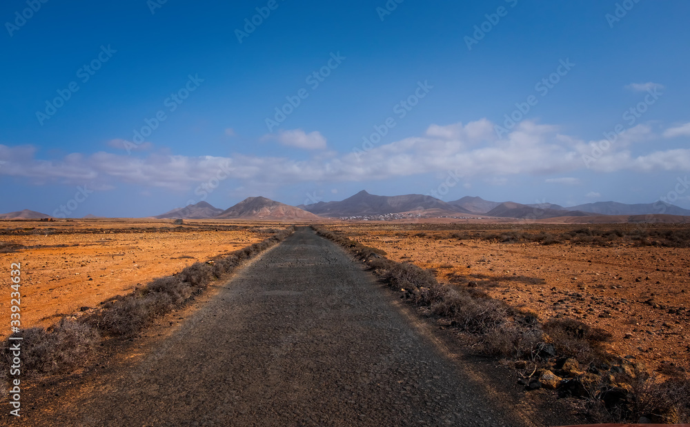 The beautiful volcanic landscape with the road in Bailadero De Las Brujas on the island of Fuerteventura. Canary Islands. Spain. October 2019