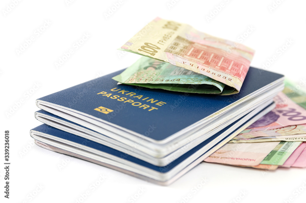 passports and hryvnia on a white background. passports and hryvnia on a white background.