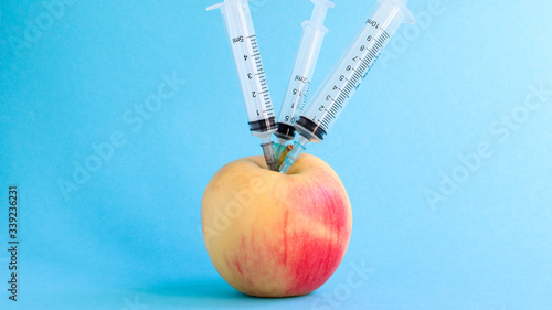 syringe with apple