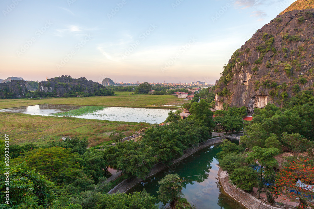Ninh Binh, Vietnam, beautiful landscape of rice fields among the mountains, view from the top of the mountain, Tam Coc National Park