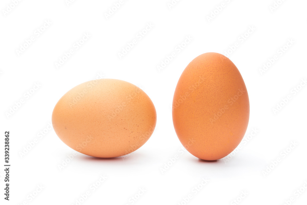 Two fresh brown chicken eggs on a white background Two fresh brown chicken eggs on a white background
