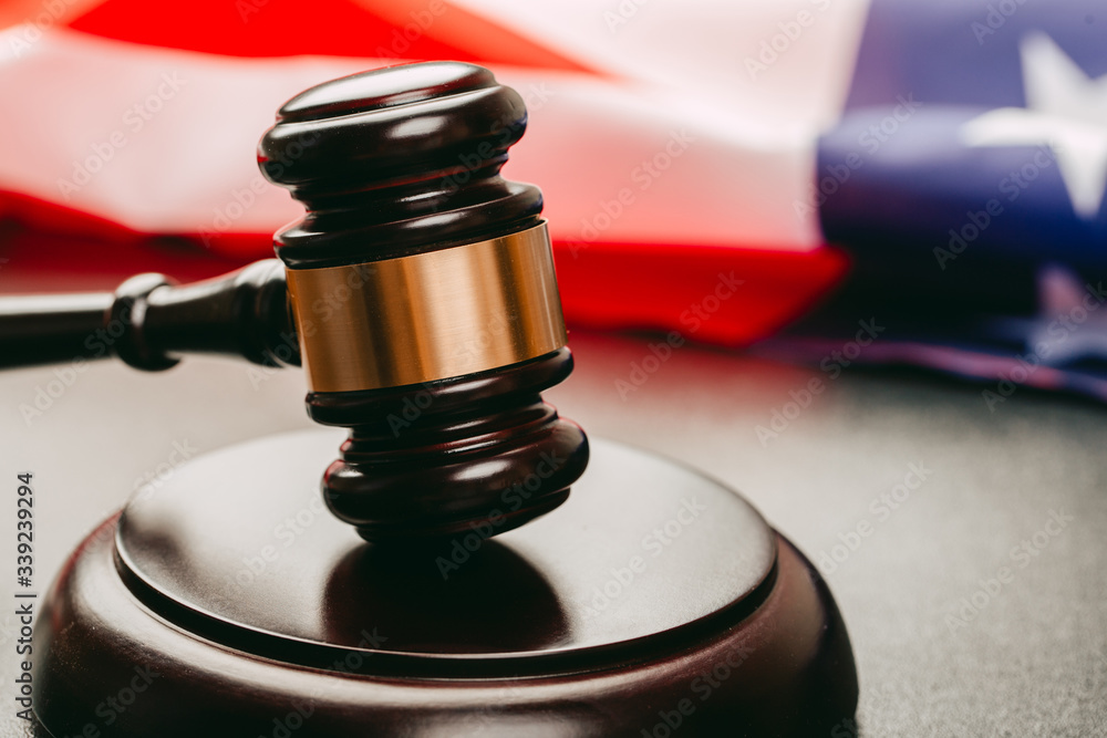 law gavel and USA america flag - American crime concept law gavel and USA america flag - American crime concept