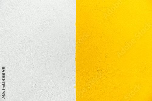 Blurred White and Yellow stucco wall background. White and Yellow painted cement wall texture.
